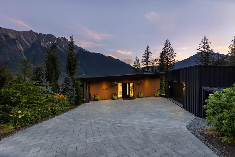 Cerulean front approach with warm interior glow at twilight