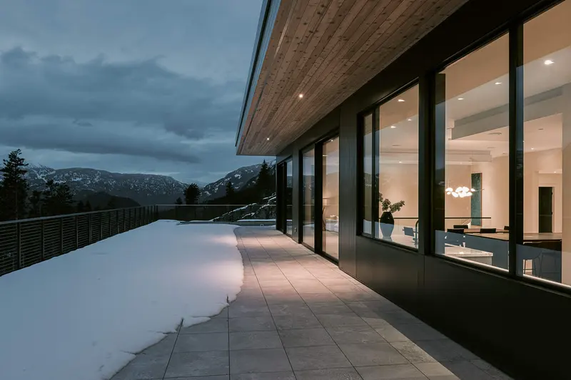 Warbler Way exterior at twilight — custom home in Whistler by Balmoral Construction